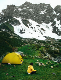 Scenic view of tent and mountains