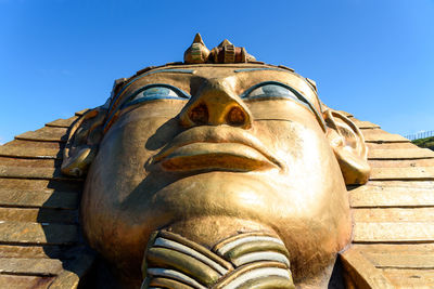 Low angle view of statue against building