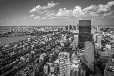 High angle view of modern buildings in city against sky