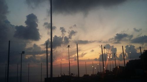 Panoramic view of silhouette city against sky during sunset