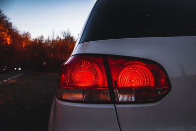 Close-up of car on road against sky
