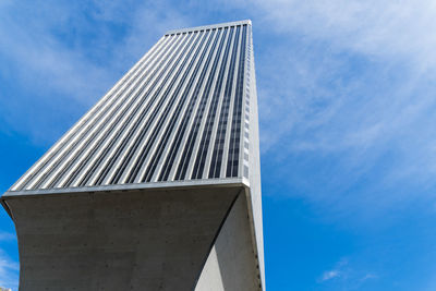 Low angle view of office building against sky