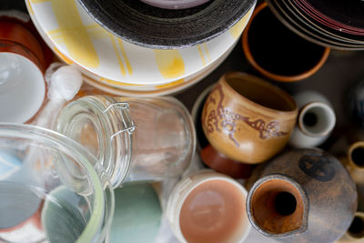 Directly above shot of jar and containers at market