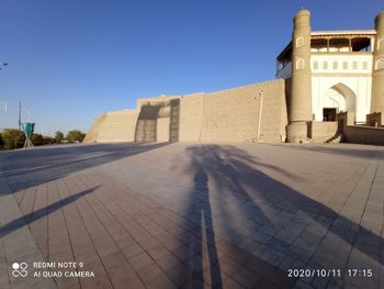 View of historic building against clear blue sky