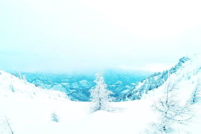 Scenic view of snow covered mountains