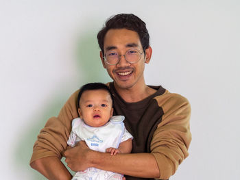 Man and baby asian and nationality thai is happy feel