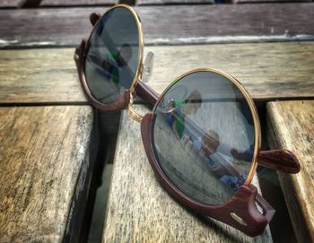 Close-up of hand holding sunglasses