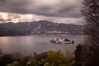 High angle view of isola san giulio in lake orta against mountains