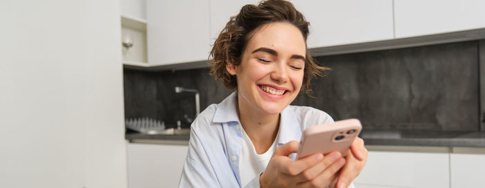 Young woman using mobile phone