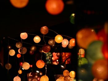 Low angle view of illuminated christmas lights