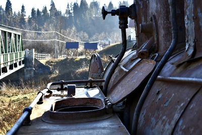 Close-up of abandoned rusty metallic vehicle