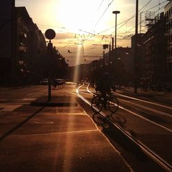 Road passing through city at night