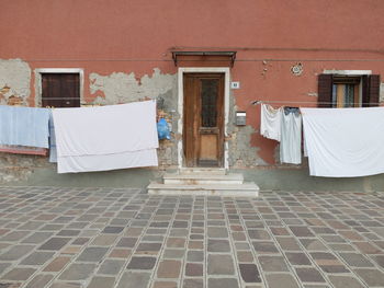 Clothes drying outside house