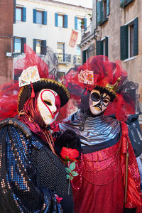 Venice, italy. people in masks and costumes at carnival