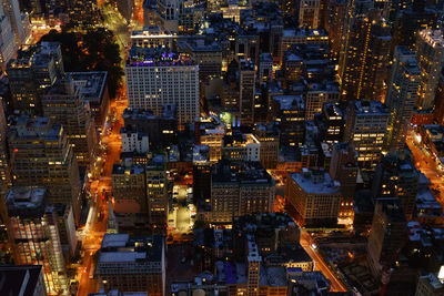 High angle view of illuminated cityscape at night