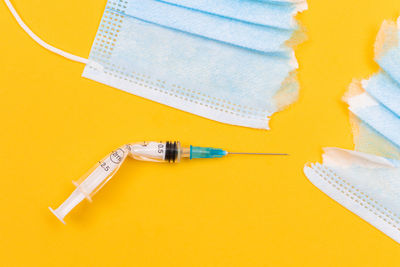 High angle view of yellow paper on table
