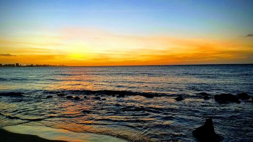 Scenic view of sea against sky during sunset