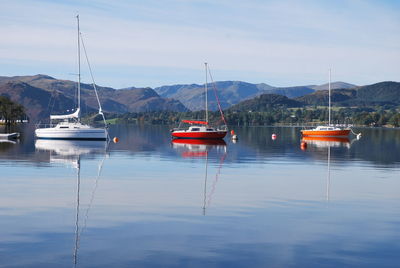 Scenic view of wet mountains against sky