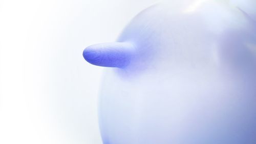 Close-up of human hand against white background