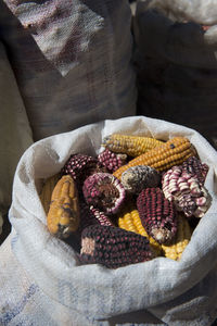 High angle view of corns in sack for sale at farmer market