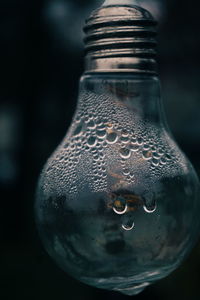 Close-up of wet glass bottle