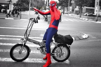 Man riding bicycle on road