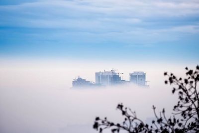 Buildings in city against sky