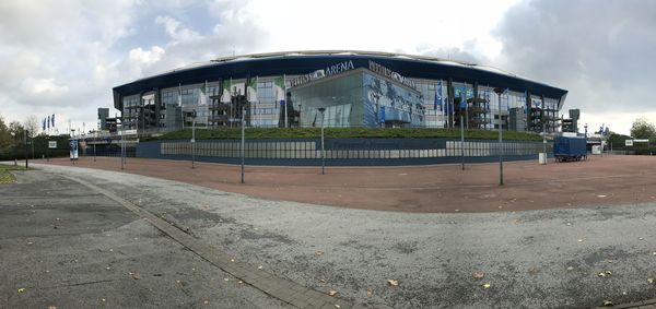 View of abandoned building against cloudy sky