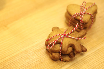 Christmas gingerbread cookies on a wooden background, baking