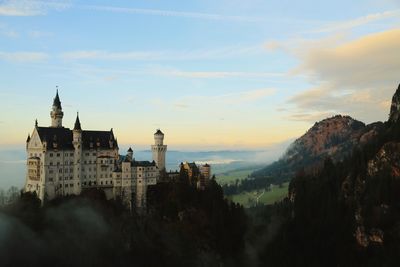 Buildings against sky during sunset