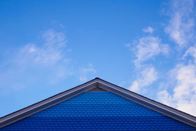 Low angle view of building against blue sky