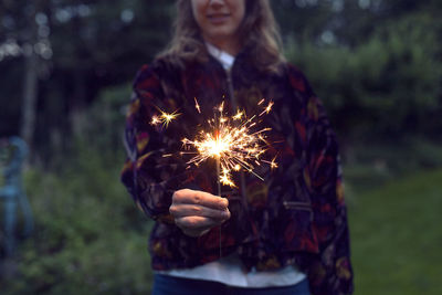 Woman holding sparkler
