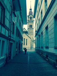Alley amidst buildings in city