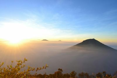 Scenic view of mountains against sky during sunset