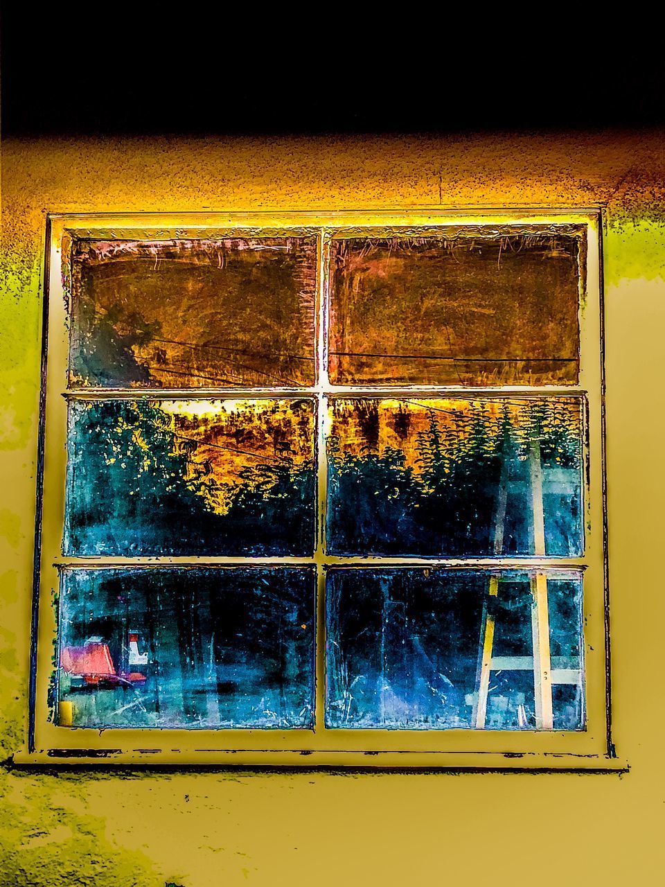 REFLECTION OF WINDOW ON OLD HOUSE