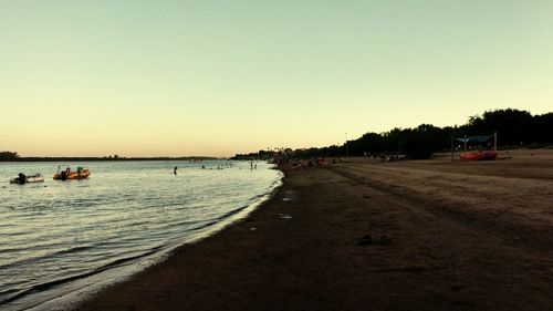 Scenic view of beach against clear sky