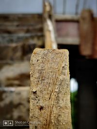 Close-up of wooden post on fence