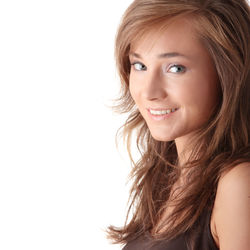 Portrait of a smiling young woman over white background