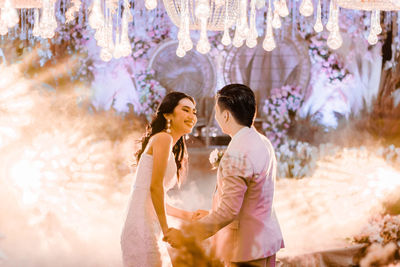 Young couple standing outdoors