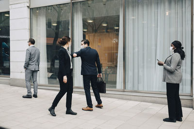 Group of people walking in office building