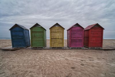 Beach hut against sky