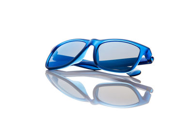 Close-up of sunglasses against white background