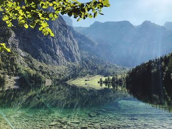 Scenic view of river amidst mountains