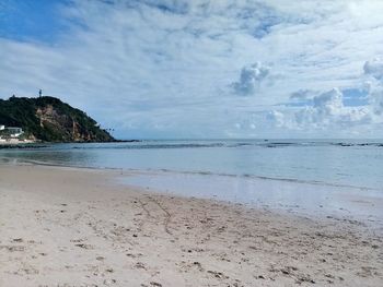 Scenic view of beach against sky