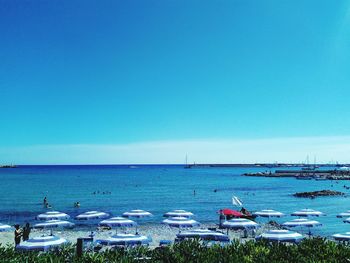 Scenic view of sea against clear blue sky