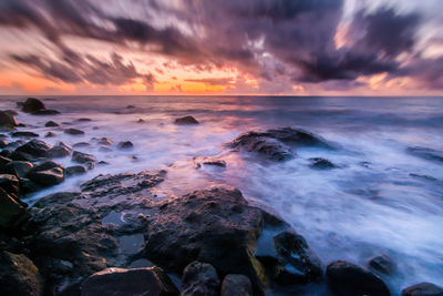 Scenic view of sea against sky during sunset