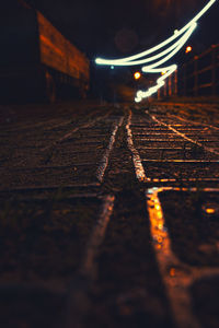 Surface level of railroad tracks at night