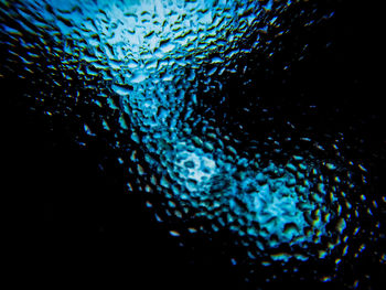 Close-up of illuminated blue water