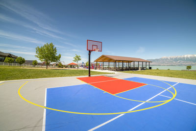 View of basketball court against blue sky