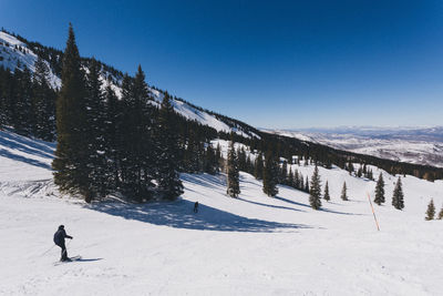 Scenic view of snowcapped mountain against clear sky